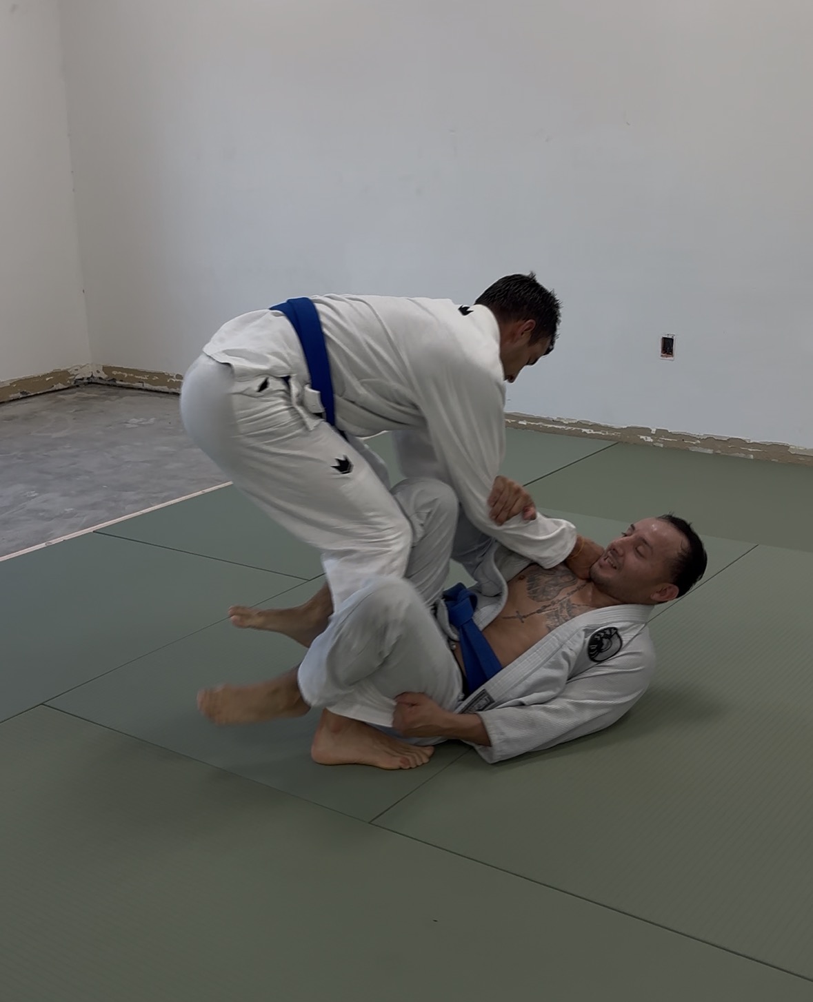 Mixed-level adult Brazilian Jiu-Jitsu Gi class training together at Makoto Jiu Jitsu Academy