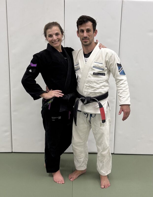Two academy members posing together after training